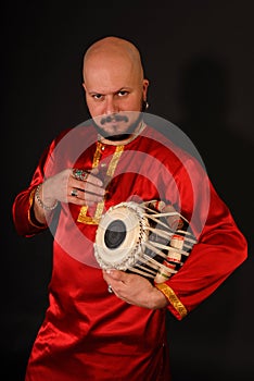 Bold handsome oriental percussionist