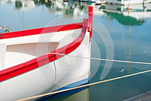 Bold red, white blue closeup of aft of Mediterranean fishermans boat