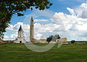 Old orthodox church and the ancient islamic minaret photo