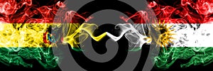 Bolivia, Bolivian vs Kurdistan, Kurdish smoky mystic states flags placed side by side. Concept and idea thick colored silky