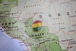 Bolivia flag drawing pin on the map