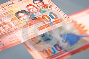 Bolivia money, Paper banknotes worth 100 Bolivianos. Both sides of the banknote photo