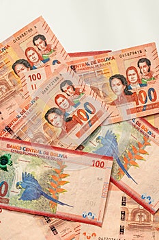 Bolivian banknotes of 100 bolivianos, a lot of money, Vertical, close up, Concept, Bolivia finance photo