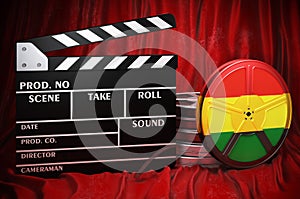 Bolivian cinematography, film industry, cinema in Bolivia. Clapperboard with and film reels on the red fabric, 3D rendering