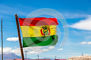 Bolivian Flag waving in the wind against blue sky background