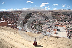 Bolivian woman and mountain view of La Paz, Bolivia