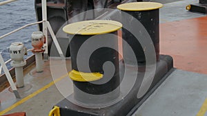 Bollard with hawse and snap back zone on deck of ship