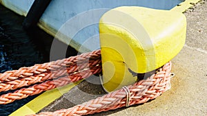 Bollard trussed wrapped with mooring rope.