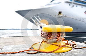 Bollard on which a large ship is moored with ropes