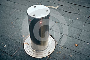 Bollards can be retracted into the roadway to allow traffic photo