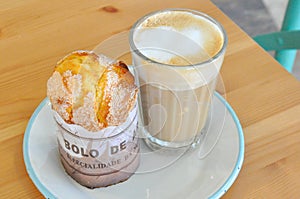 Bolo de Arroz and GalÃÂ£o. Portuguese rice muffin and lattee. photo