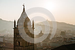 Bologna, cityscape and buildings at sunset, San Pietro Cathedral Bell Tower and San Luca hill. Emilia Romagna, Italy