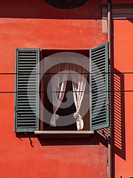 Bologna house window with wooden shutters