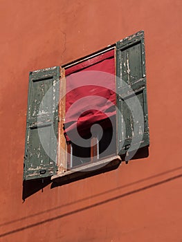 Bologna house window with wooden shutters