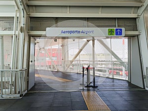 Bologna ITALY - 9 August 2023 - Empty airport exit structure with information sign towards Marconi Express