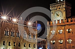 Bologna, Italy. The clock tower Piazza Maggiore at night