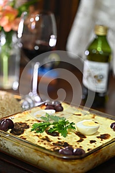 bolognese lasagna baked with cheese ham red sauce spices and meat with french fries and rice