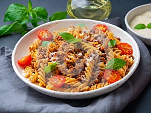 Bolognese pasta. Fusilli with tomato sauce, ground minced beef,