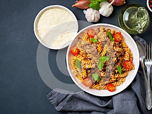 Bolognese pasta. Fusilli with tomato sauce, ground minced beef,