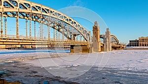 Bolsheokhtinsky Bridge through the Neva River in St. Petersburg in the winter day