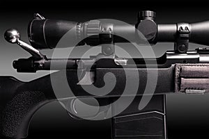 bolt action rifle with riflescope close up on black background, copy space