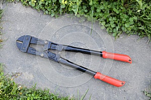 Bolt cutter on concrete surface construction concept.hardware store and manual work tools concept with boltcutter