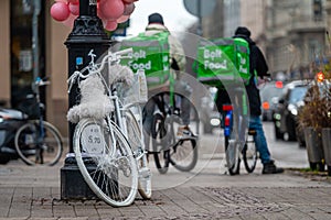 Bolt Food Couriers On Bicycles. Fast delivery of food by bicycle. Rear view