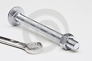Bolt, nut and a wrench. Conceptual image
