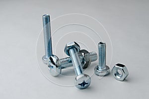 Bolt and nuts screwed together photo