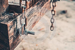 The bolt on the old wood swing and chain