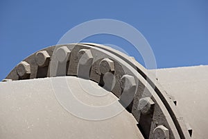 The bolted coupling on an industrial pipeline.