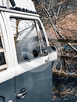 Drivers door and wing mirror of classic Volkswagen camper van