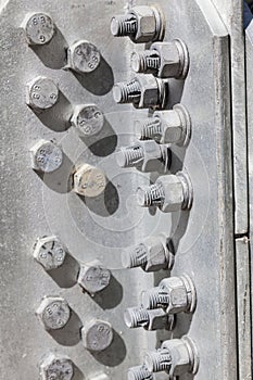 Bolts and nuts in the structure of a steel tower photo