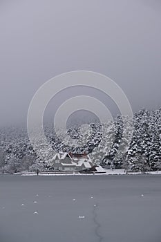 Bolu Golcuk National Park, lake wooden house on a snowy winter day in the forest in Turkey