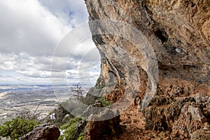 Bolumini cave over snowy landscape with blue sky.