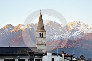 Bolzano, South Tyrol, Italy - view of a bell tower and Dolomites mountains