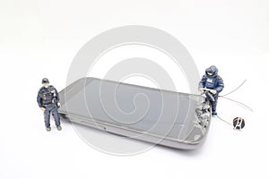 A Bomb squad expert defusing bomb on mobile phone