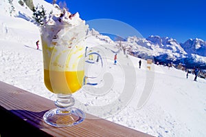 Bombardino with whipped cream on the mountain slopes