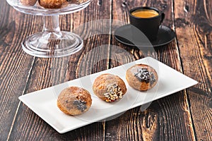 Bombolone or bomboloni is an Italian filled donut and snack food. German donuts - krapfen or berliner - filled with jam and