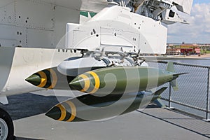 Bombs mounted under wings of a jet