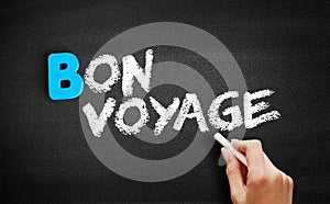 Bon Voyage text on blackboard