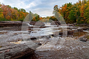 Bonanza Falls in a forest in autumn in Michigan, the US