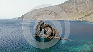 Bonanza Rock in El Hierro canary island. Volcano basalt formation in the sea like a elephant and arch