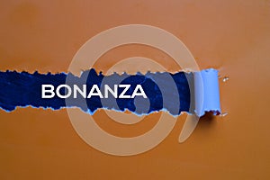 Bonanza Text written in torn paper