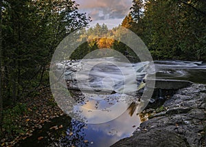 Bond falls in Michigan upper peninsula with sun light reflections