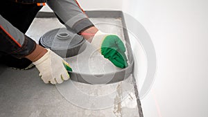 Bonding the floor with a damper tape. Installing a damping tape. Damping tape for floor screed. Before pouring the floor