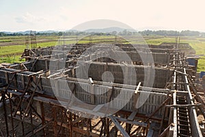 Bonding of reinforcement, making formwork, timbering on construction site.