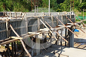 Bonding of reinforcement, making formwork, timbering on construction site.