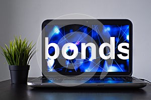 Bonds and debt financial instruments, concept. Laptop on the table