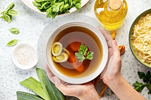 Bone broth in a bowl, top down view